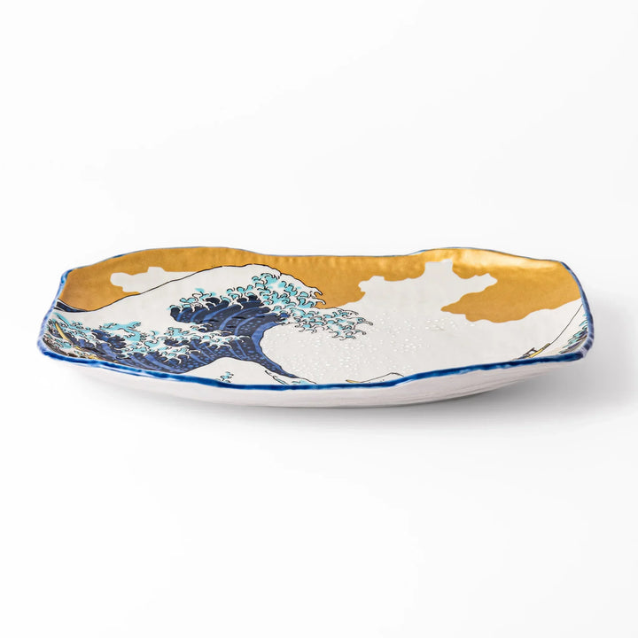 Rectangular Japanese serving plate with Hokusai Great Wave design in vivid blue gold and white for dining.