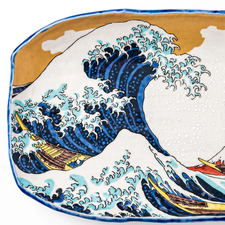 Rectangular Japanese serving plate with Hokusai Great Wave design in vivid blue gold and white for dining.