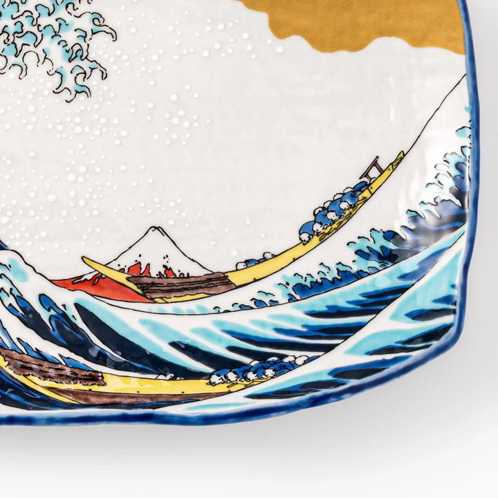 Rectangular Japanese serving plate with Hokusai Great Wave design in vivid blue gold and white for dining.
