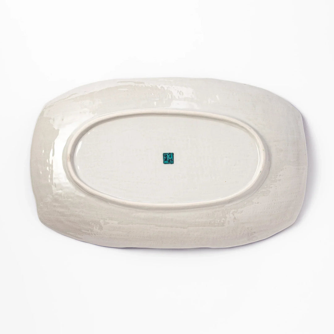 Rectangular Japanese serving plate with Hokusai Great Wave design in vivid blue gold and white for dining.