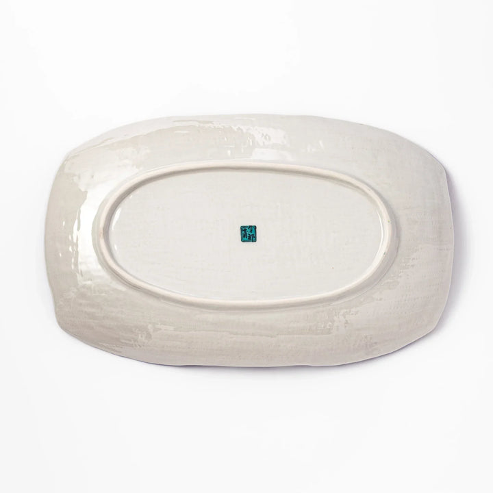 Rectangular Japanese serving plate with Hokusai Great Wave design in vivid blue gold and white for dining.