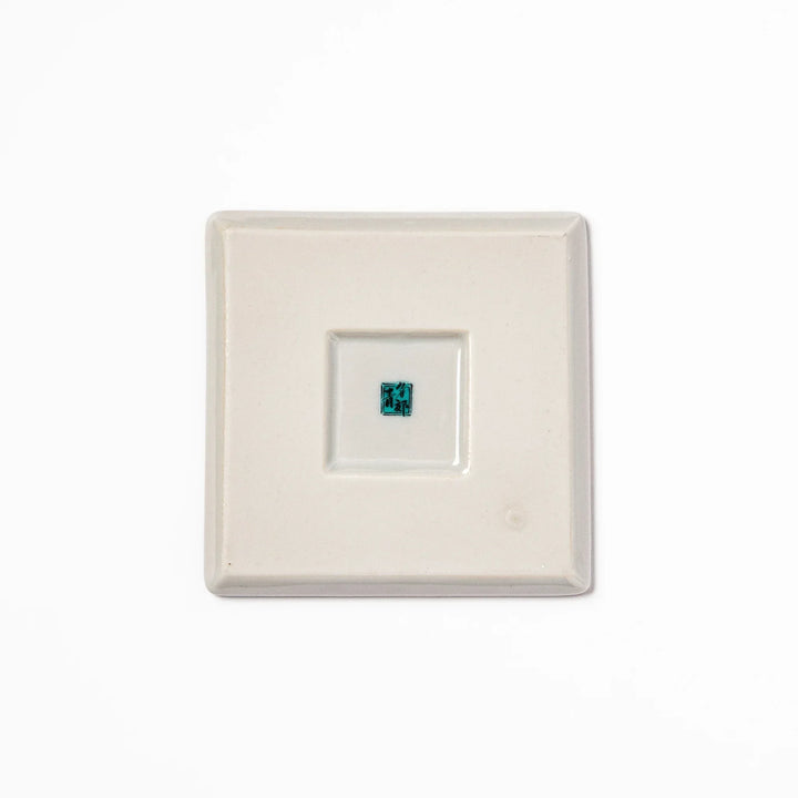 Square Japanese ceramic coaster with Hokusai Red Fuji design showing red mountain blue sky and white clouds.