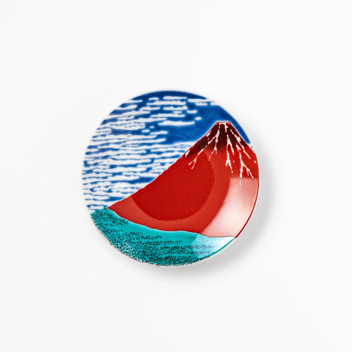Round Japanese ceramic sauce dish with Hokusai Red Fuji design featuring red mountain blue sky and clouds.