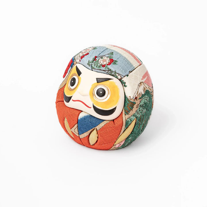 Fabric daruma ornament with bright multicolor kimono pattern and bold painted face