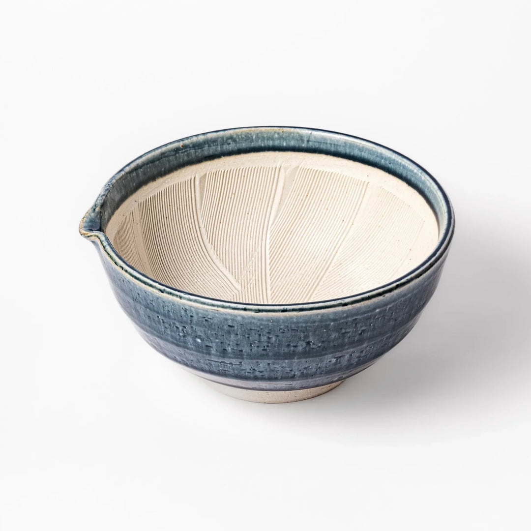Indigo Japanese suribachi mortar with cream grooved interior and spout for grinding sesame herbs and spices.