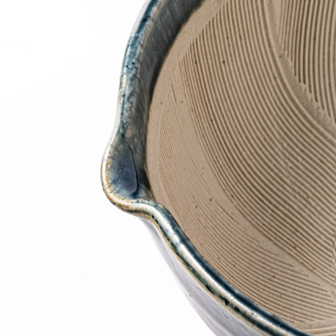 Indigo Japanese suribachi mortar with cream grooved interior and spout for grinding sesame herbs and spices.