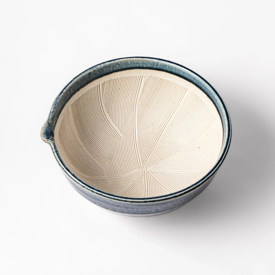 Indigo Japanese suribachi mortar with cream grooved interior and spout for grinding sesame herbs and spices.