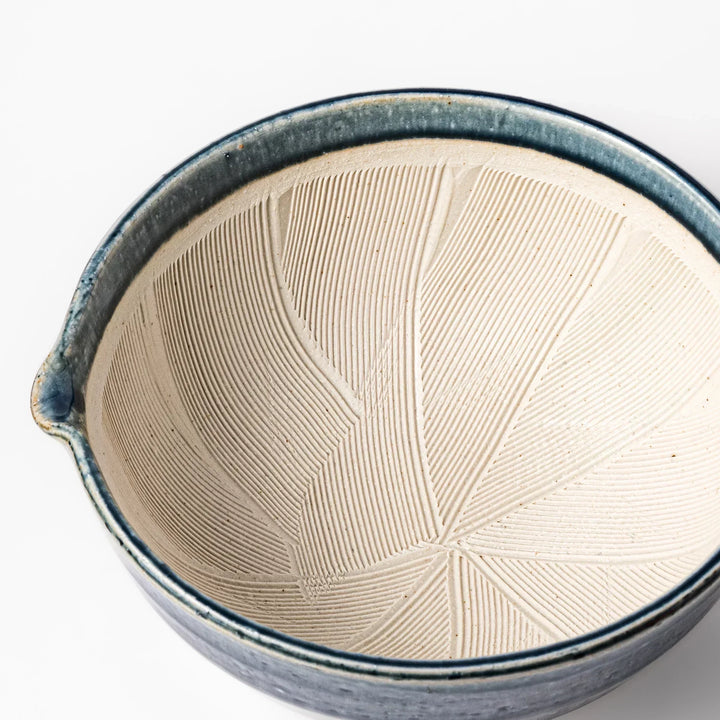 Indigo Japanese suribachi mortar with cream grooved interior and spout for grinding sesame herbs and spices.