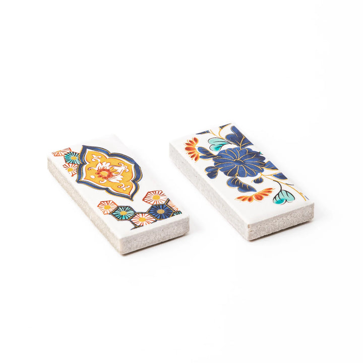 Two rectangular ceramic chopstick rests decorated with colorful traditional Japanese floral and arabesque patterns
