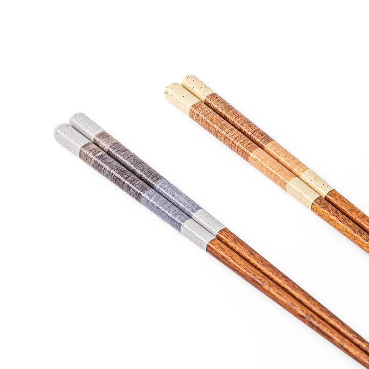 Close up of Japanese chopsticks showcasing a unique multi colored wrapped thread texture on the handles