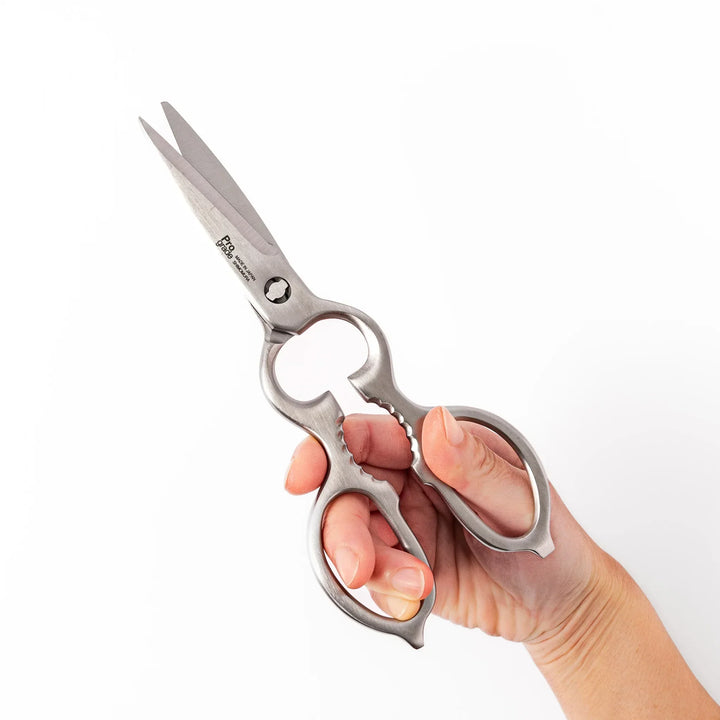 Japanese stainless steel kitchen shears with sharp blades and grip for cutting meat seafood and vegetables.