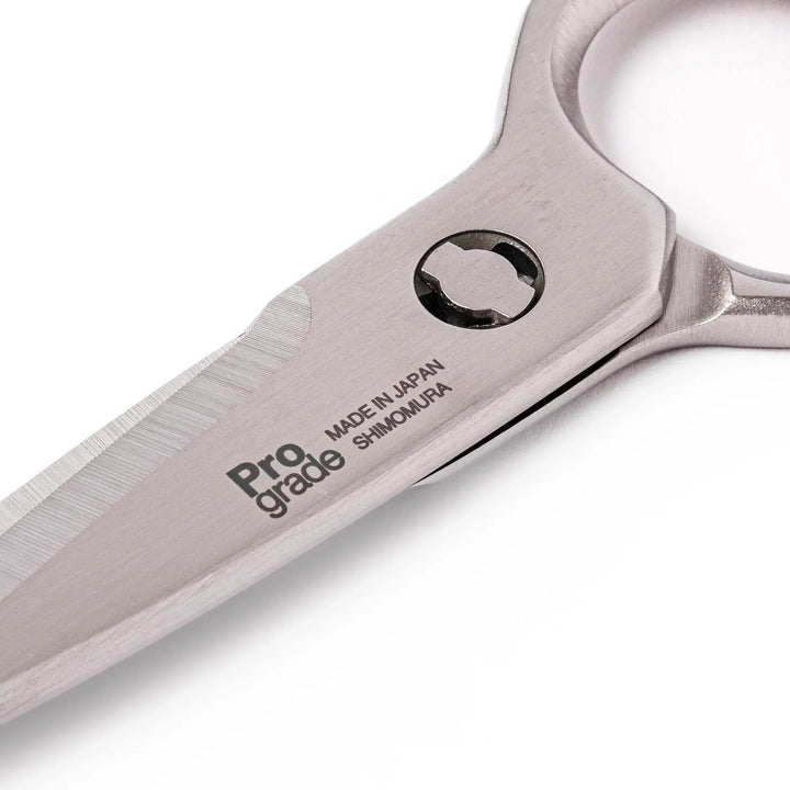 Japanese stainless steel kitchen shears with sharp blades and grip for cutting meat seafood and vegetables.