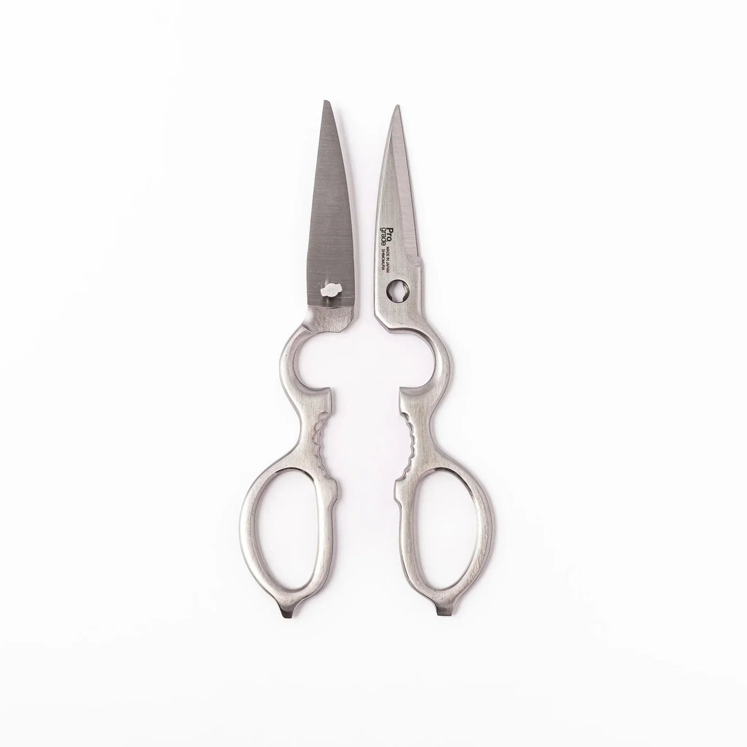 Japanese stainless steel kitchen shears with sharp blades and grip for cutting meat seafood and vegetables.