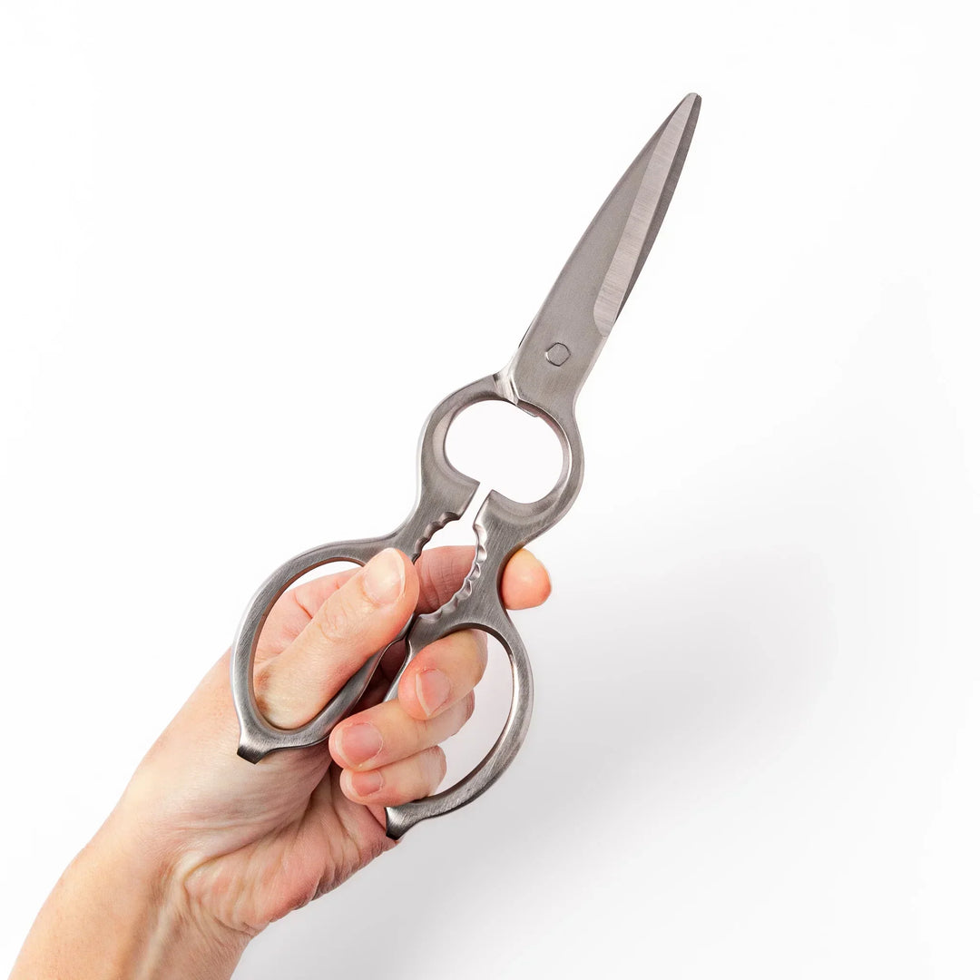 Japanese stainless steel kitchen shears with sharp blades and grip for cutting meat seafood and vegetables.