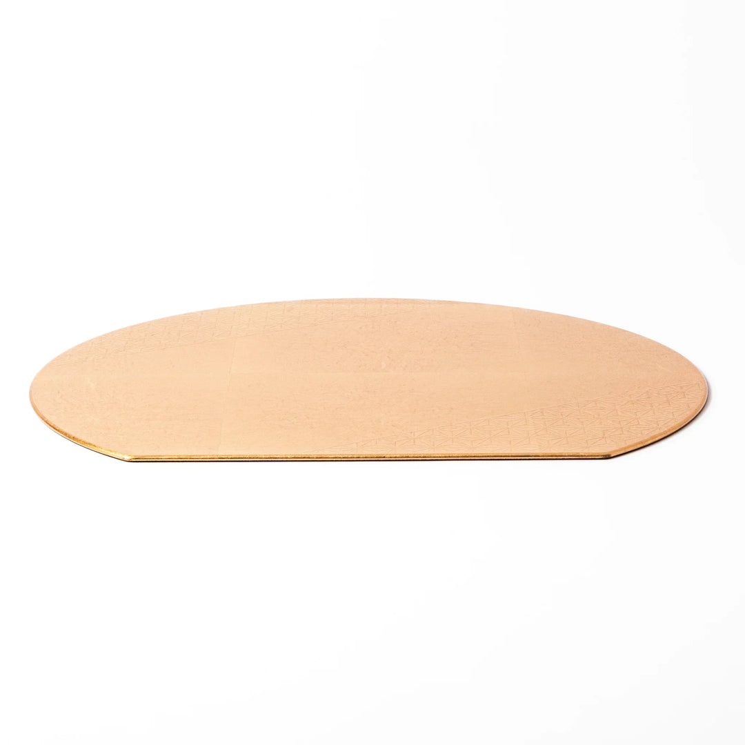 Gold Japanese Asanoha hemp leaf placemat with semicircular shape and embossed pattern for elegant table.