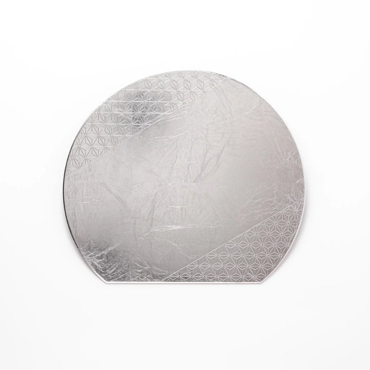 Silver Japanese Asanoha hemp leaf placemat with semicircular shape and embossed pattern for refined table.