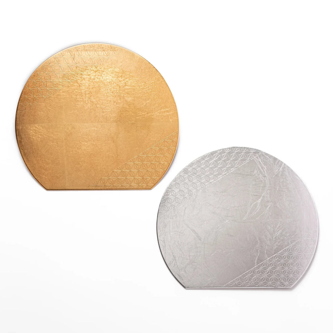 Japanese Asanoha hemp leaf placemats in gold and silver with semicircular shape and embossed pattern.