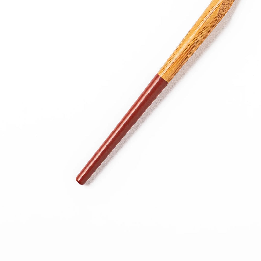 Set of five Japanese bamboo cocktail forks with red handles and a natural bamboo finish for appetizers and desserts
