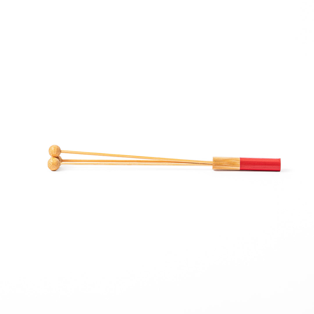 Single Japanese bamboo drink stirrer featuring a red handle top and wooden bead tips for mixing cocktails or tea
