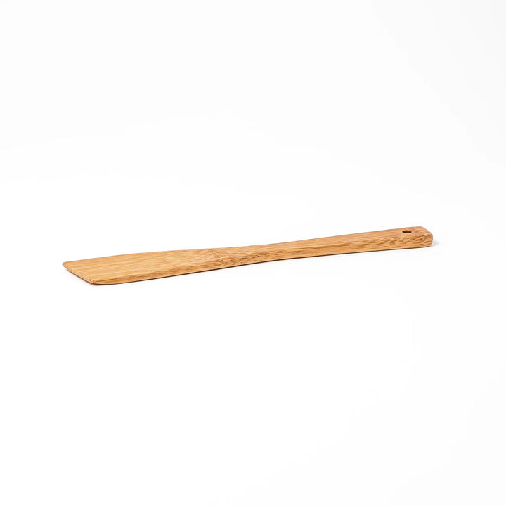 Handcrafted Japanese bamboo spatula for rice and pilaf featuring a natural bamboo finish and a convenient hanging hole