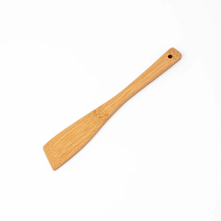 Handcrafted Japanese bamboo spatula for rice and pilaf featuring a natural bamboo finish and a convenient hanging hole