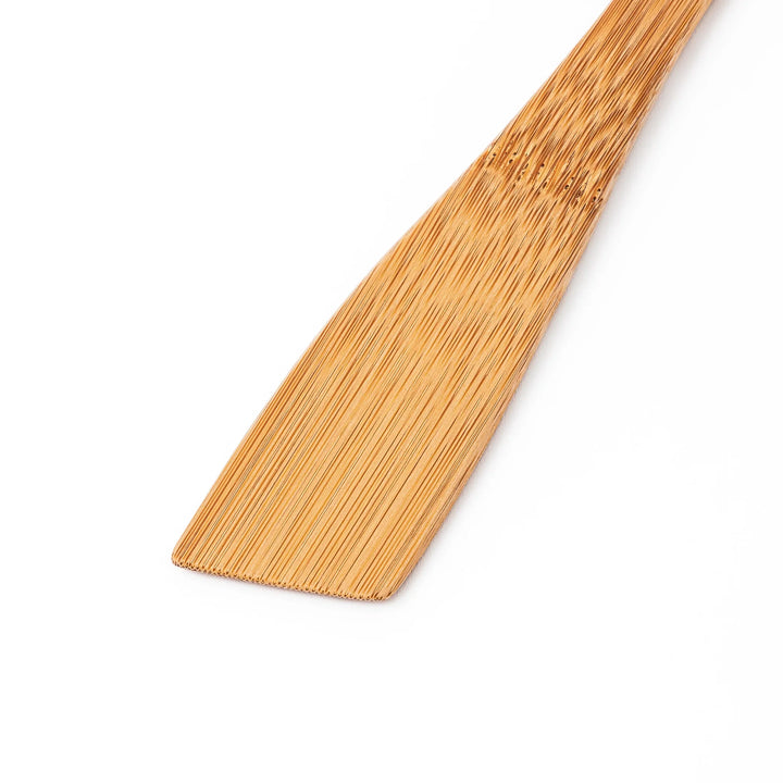 Handcrafted Japanese bamboo spatula for rice and pilaf featuring a natural bamboo finish and a convenient hanging hole