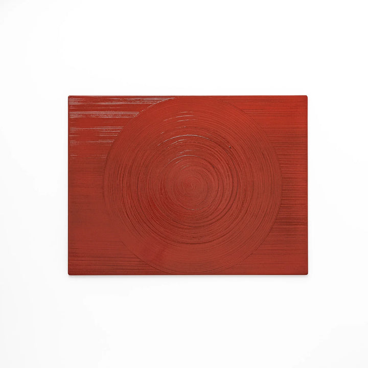 Reversible Japanese lacquer tray with circular brush texture in red and black for modern dining style.