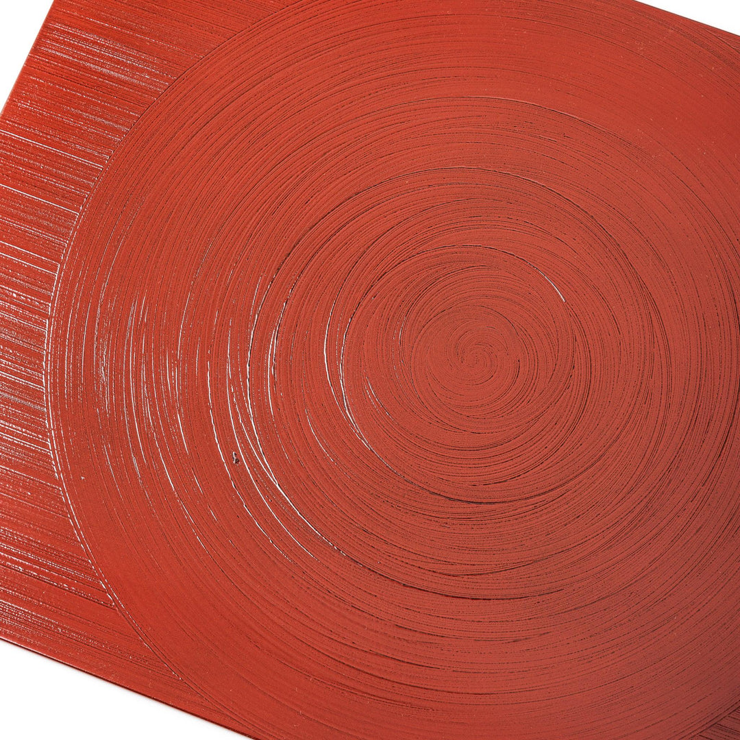 Reversible Japanese lacquer tray with circular brush texture in red and black for modern dining style.