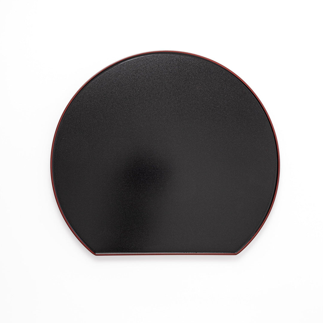 Reversible Japanese half moon lacquer tray in red and black for minimalist and modern dining presentation.