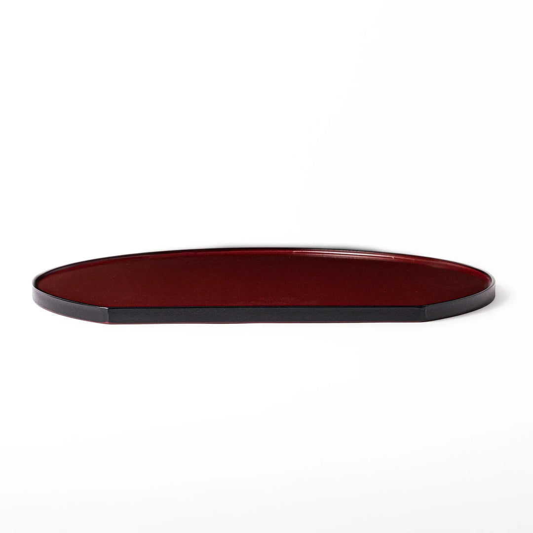 Reversible Japanese half moon lacquer tray in red and black for minimalist and modern dining presentation.