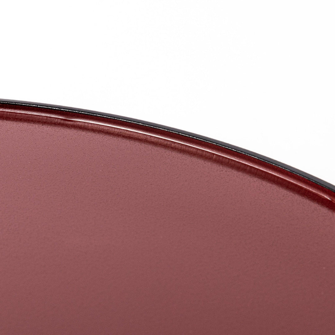 Reversible Japanese half moon lacquer tray in red and black for minimalist and modern dining presentation.