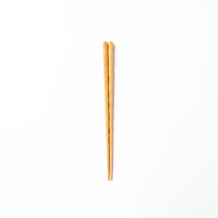 Japanese Hinoki wood carved chopsticks with textured hand-carved surface, lightweight design highlighting natural grain.