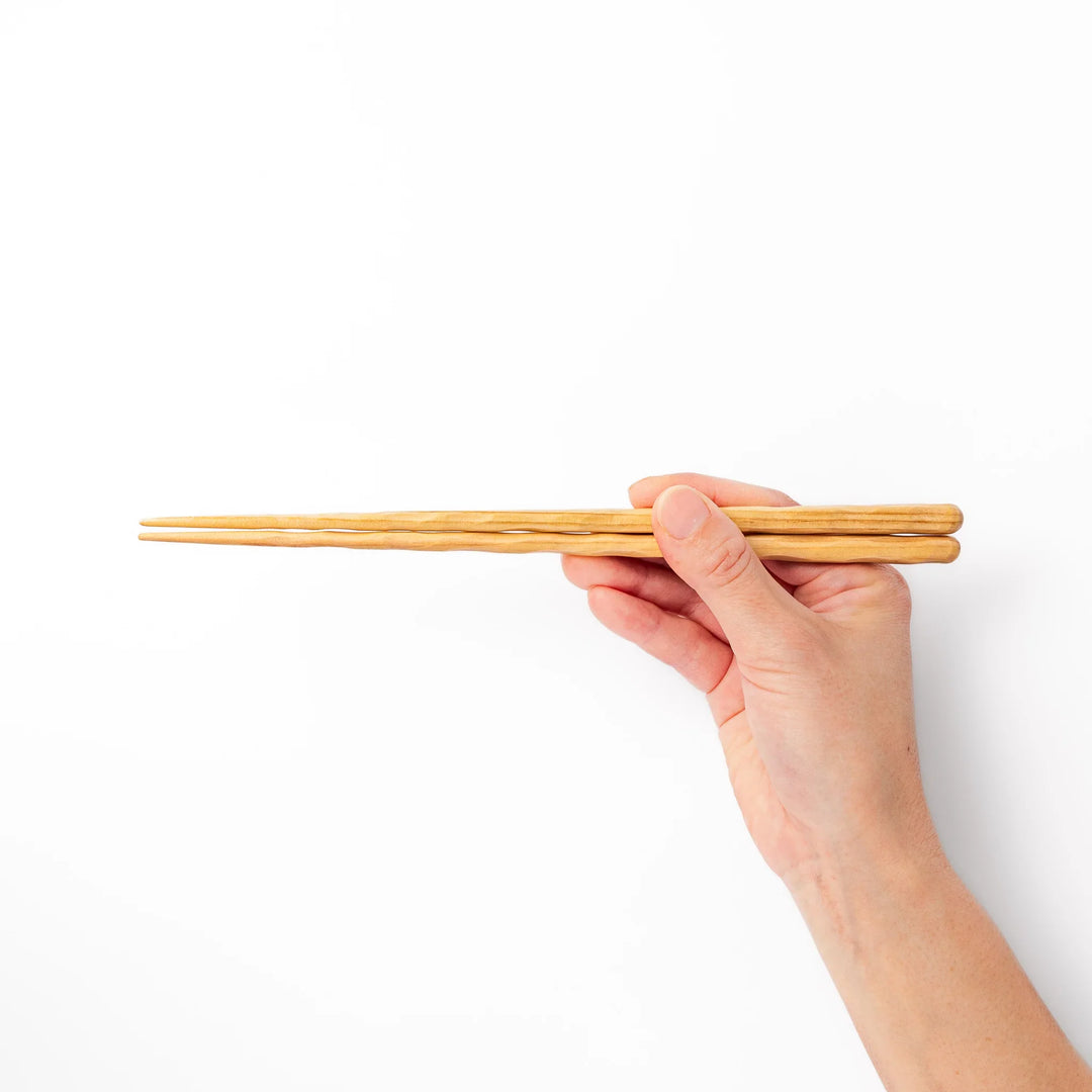 Japanese Hinoki wood carved chopsticks with textured hand-carved surface, lightweight design highlighting natural grain.