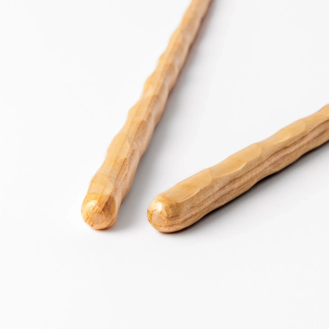 Japanese Hinoki wood carved chopsticks with textured hand-carved surface, lightweight design highlighting natural grain.