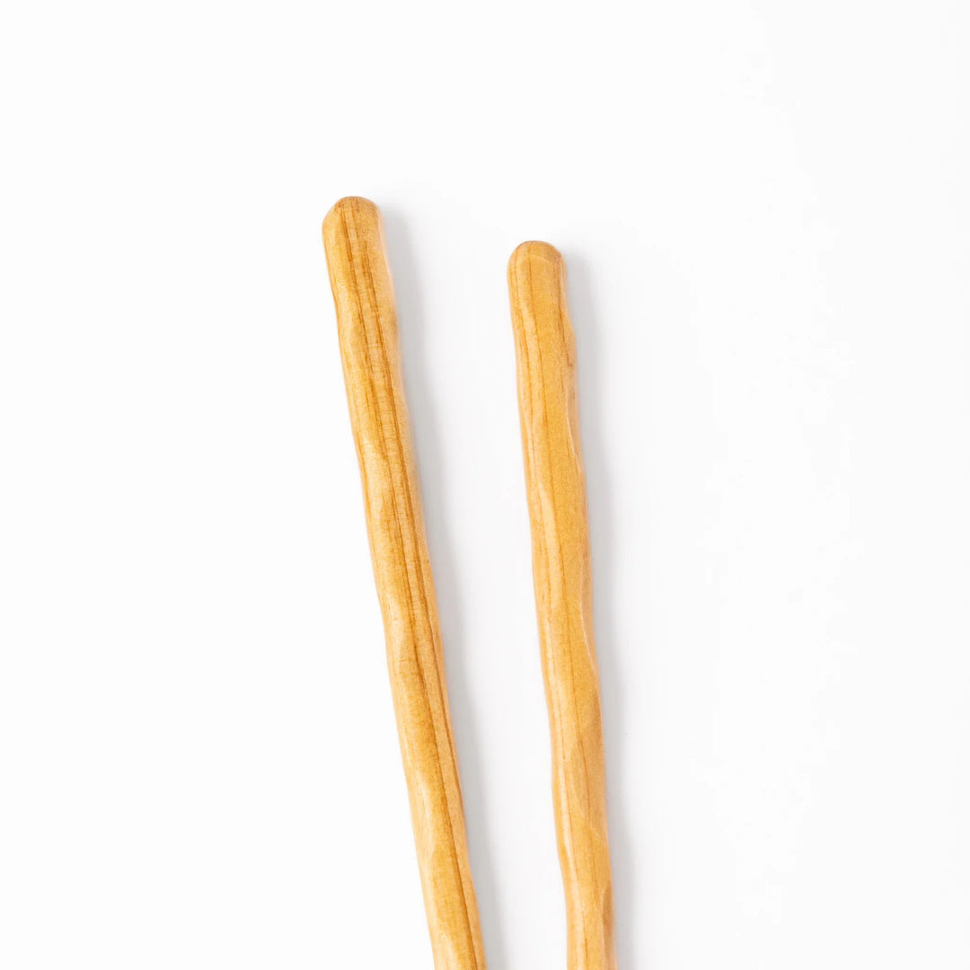 Japanese Hinoki wood carved chopsticks with textured hand-carved surface, lightweight design highlighting natural grain.