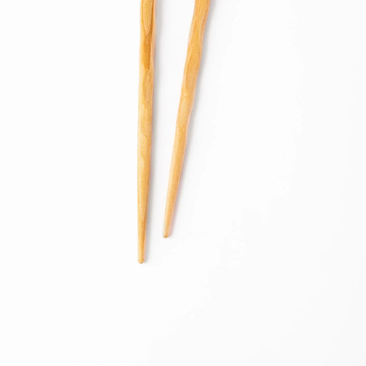 Japanese Hinoki wood carved chopsticks with textured hand-carved surface, lightweight design highlighting natural grain.
