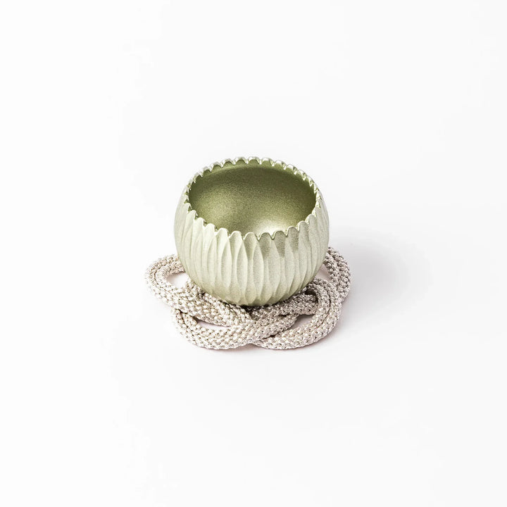 Lime green Japanese hydrangea mini prayer bowl with petal texture gold striker and silver knot cushion.