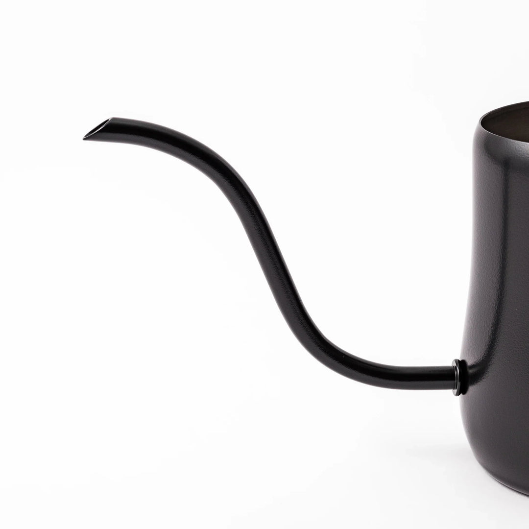 Japanese matte black pour kettle with gooseneck spout and ergonomic handle for precise coffee brewing.