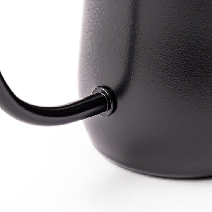 Japanese matte black pour kettle with gooseneck spout and ergonomic handle for precise coffee brewing.