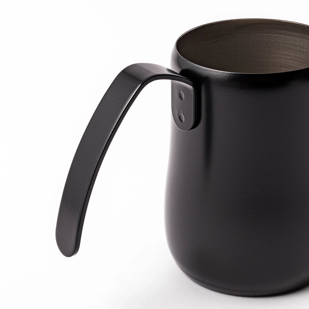Japanese matte black pour kettle with gooseneck spout and ergonomic handle for precise coffee brewing.