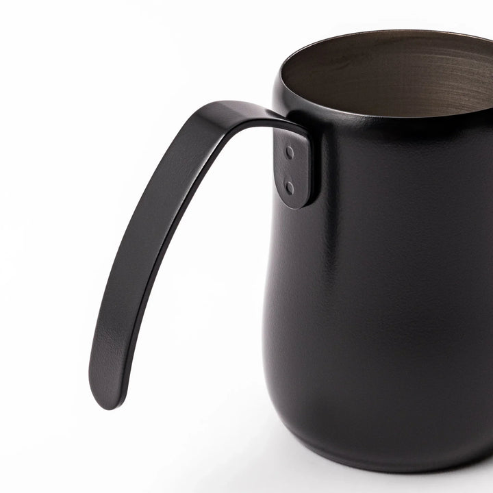 Japanese matte black pour kettle with gooseneck spout and ergonomic handle for precise coffee brewing.