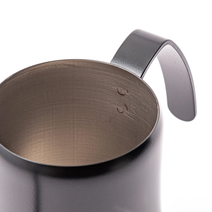 Japanese matte black pour kettle with gooseneck spout and ergonomic handle for precise coffee brewing.