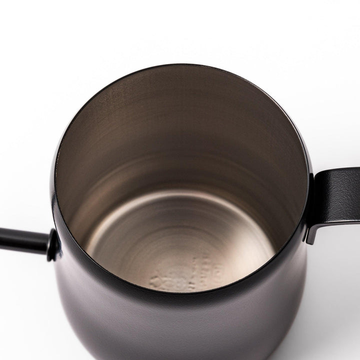Japanese matte black pour kettle with gooseneck spout and ergonomic handle for precise coffee brewing.