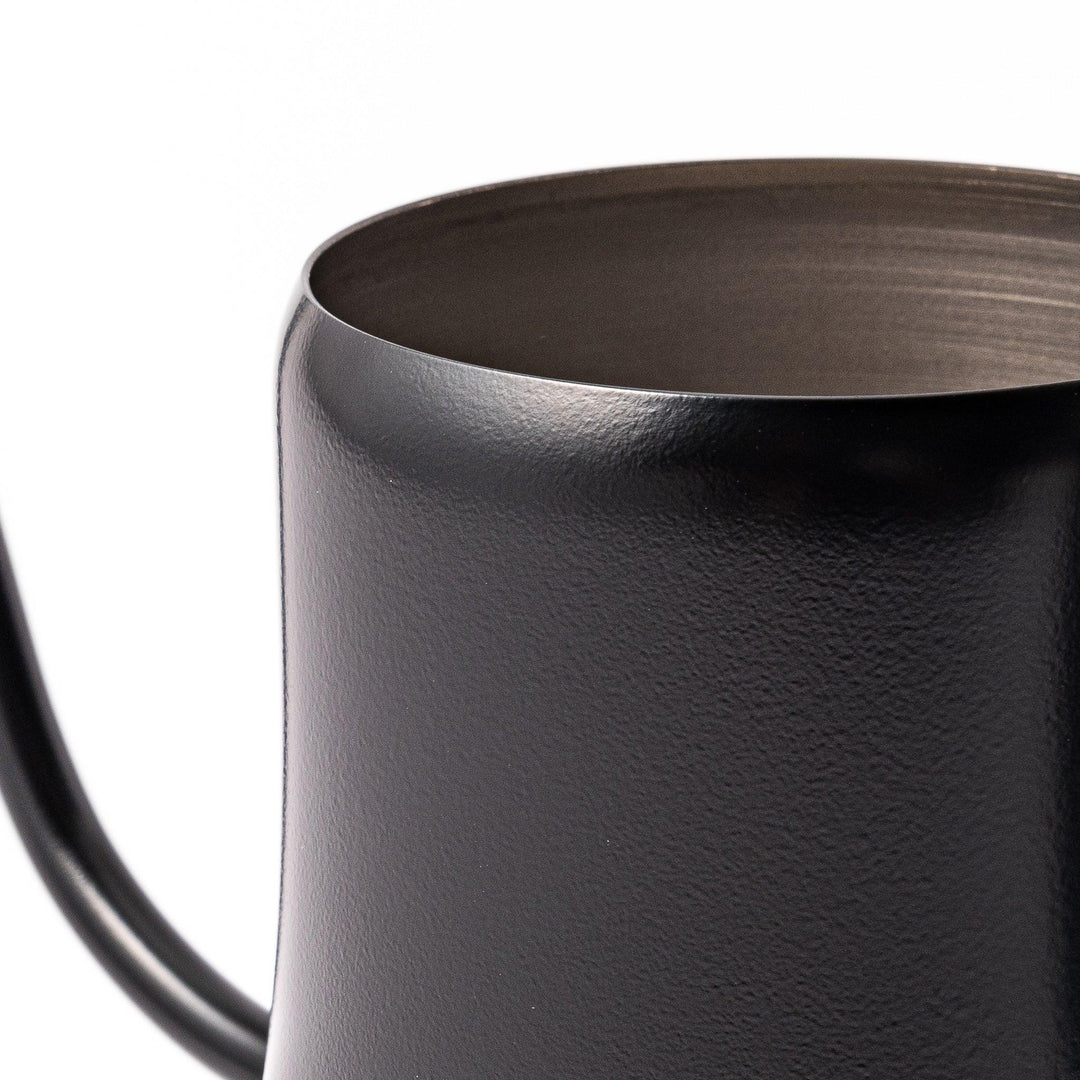 Japanese matte black pour kettle with gooseneck spout and ergonomic handle for precise coffee brewing.