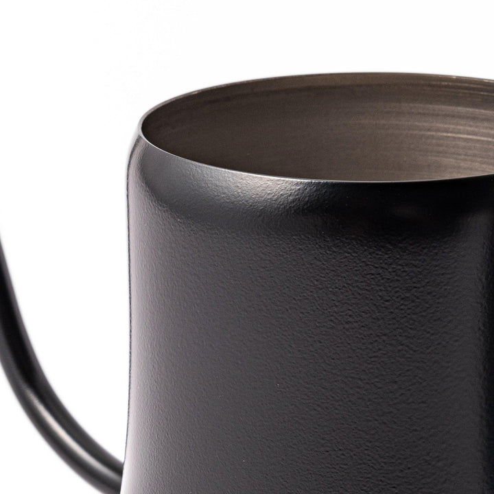Japanese matte black pour kettle with gooseneck spout and ergonomic handle for precise coffee brewing.
