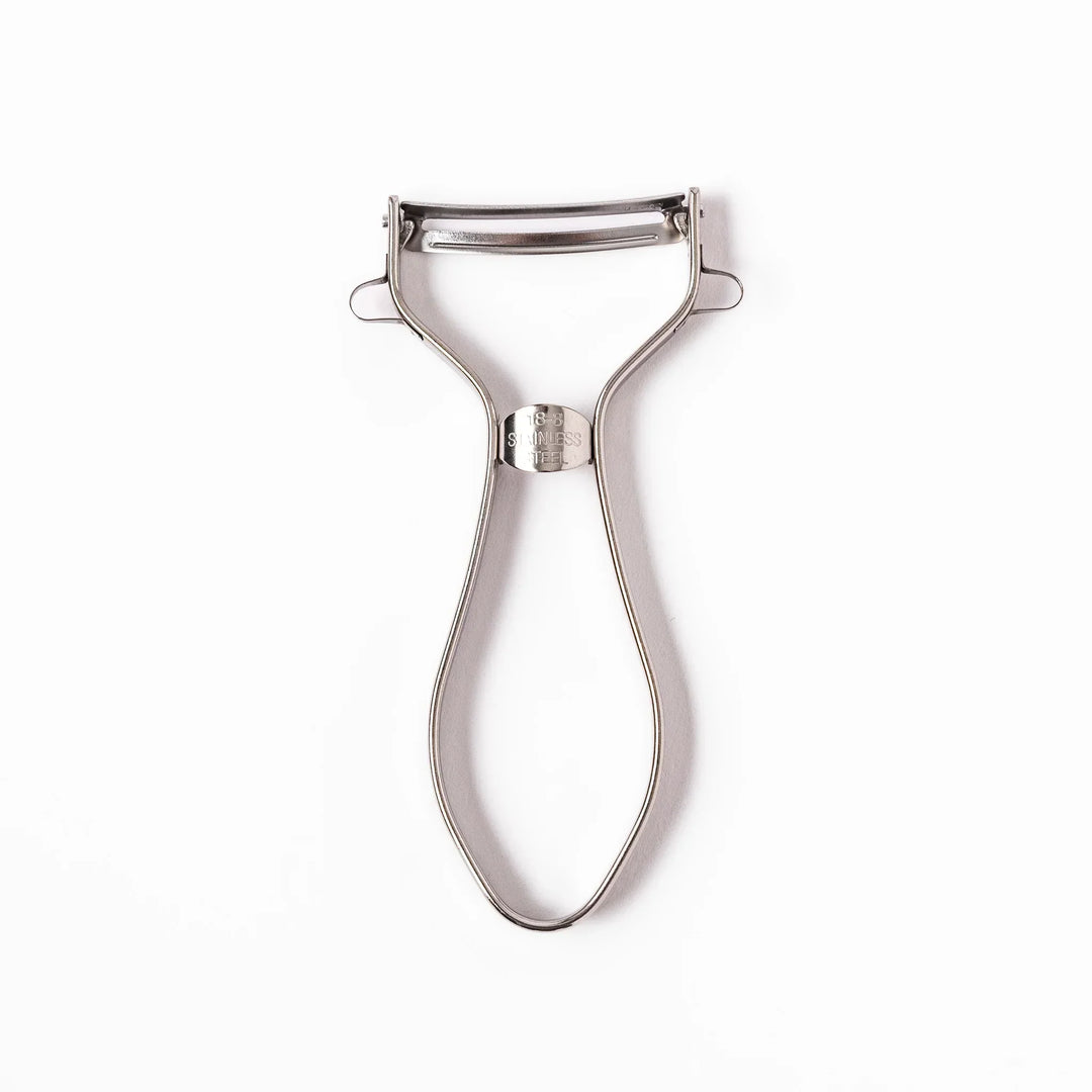 Japanese stainless steel peeler with sharp swivel blade and ergonomic handle for easy daily vegetable prep.