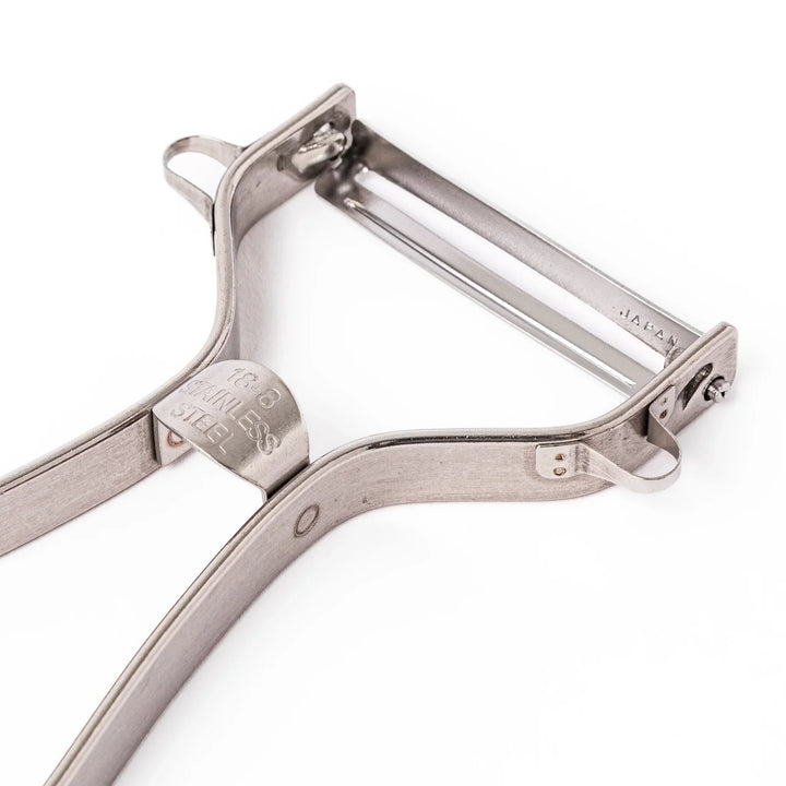 Japanese stainless steel peeler with sharp swivel blade and ergonomic handle for easy daily vegetable prep.