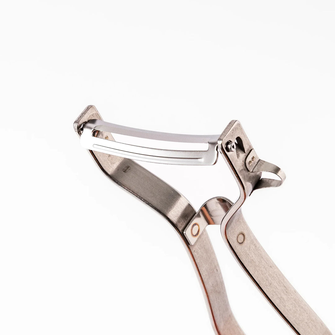 Japanese stainless steel peeler with sharp swivel blade and ergonomic handle for easy daily vegetable prep.