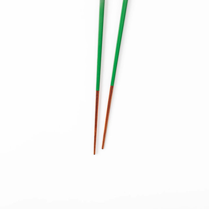 Pair of evergreen green Japanese traditional color bamboo chopsticks with fine tips for an elegant and precise dining experience