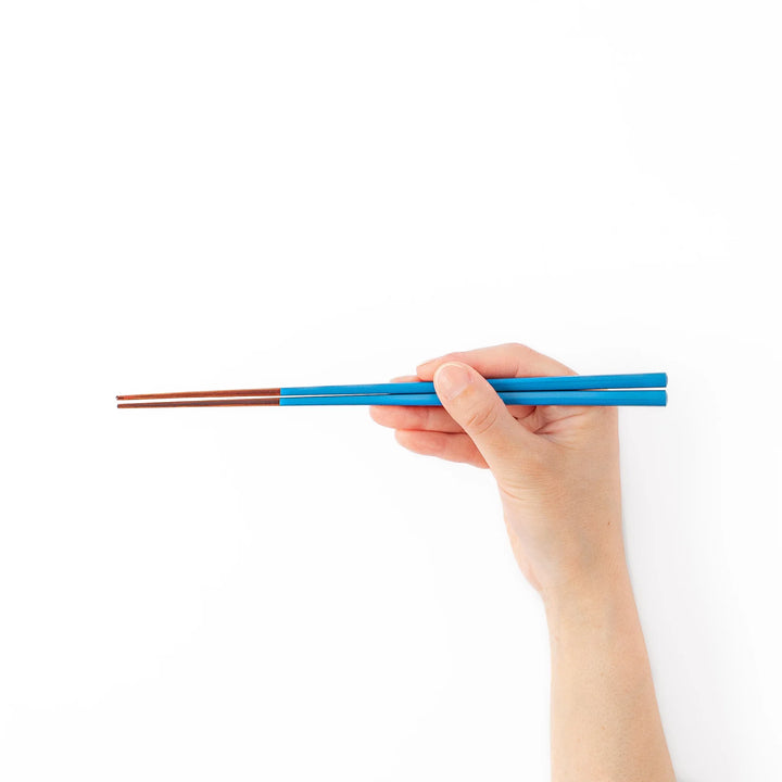 Pair of azure blue Japanese traditional color bamboo chopsticks with fine tips for an elegant and precise dining experience